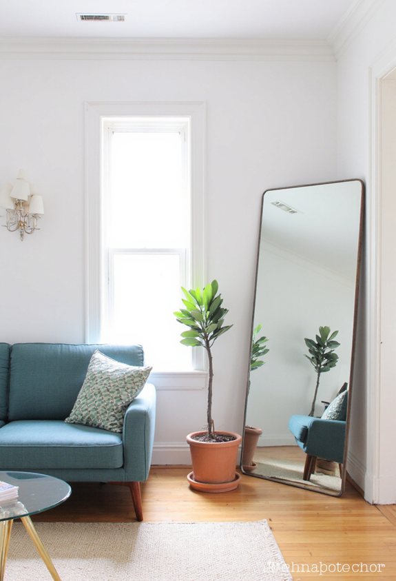 bold oversized mirror enhances space